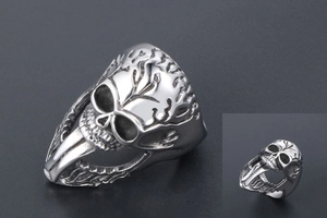 Close-up of punk skull ring with long tongue detail and oxidized silver finish
