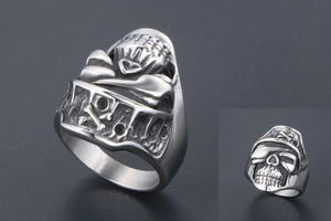 Detailed view of the vintage skull ring featuring intricate carvings and aged steel finish