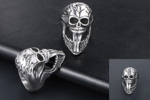 Detailed close-up of retro punk skull ring with intricate forehead engravings and silver finish