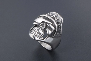 Detailed macro shot of punk style stainless steel skull ring with pirate hat motif