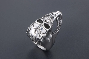 Detailed macro side view of punk gothic silver stainless steel ring with relief carving