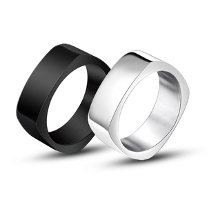Minimalist square geometric ring set in matte black and brushed silver steel