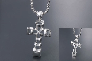 Macro view of silver titanium steel cross necklace with industrial hollow geometric design