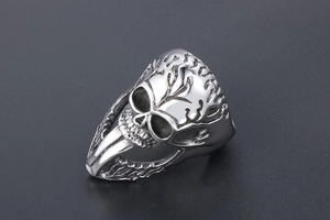 Macro detail of punk rock skull ring with vintage distressed finish and side carvings