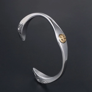 Vintage Indian style silver open eagle bracelet with gold bird emblem and feather textures