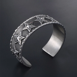 Vintage punk pentagram wide cuff bracelet with embossed stars and distressed finish