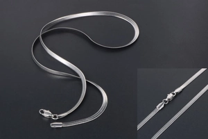 Detailed view of silver flat snake chain necklace with mirror polish and lobster clasp