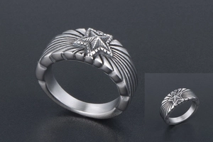 Vue macro d'une bague vintage en acier titane avec étoile 3D et rainures radiales