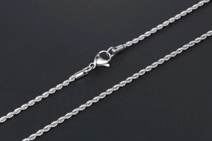 Close-up of a silver twisted rope chain necklace with a secure lobster clasp