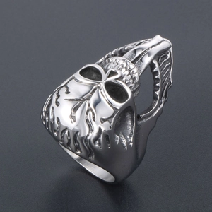 Punk style silver skull ring with long tongue and flame texture in titanium steel finish