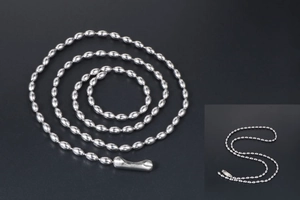 Detail of silver stainless steel rice bead chain with oval links and lobster clasp