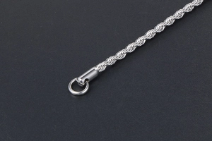 Macro shot of silver titanium steel rope chain showing exquisite texture and polished finish