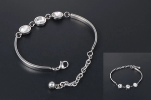 Detail of titanium steel bracelet with rhinestones, lobster clasp, and extension chain