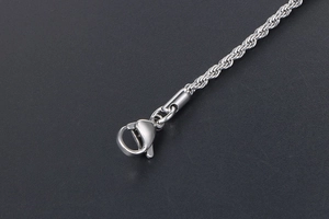 Close-up of polished silver titanium steel rope chain with a sturdy lobster clasp