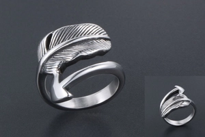 Macro shot of silver feather arrow ring with vintage black texture and adjustable band