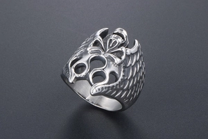 Detailed view of silver skull ring with gothic wings and vintage steel finish