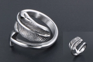 Detailed close-up of adjustable feather arrow ring in vintage polished steel
