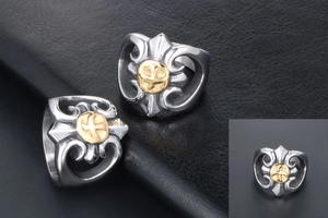 Detailed macro view of gothic punk eagle ring with golden relief on black leather