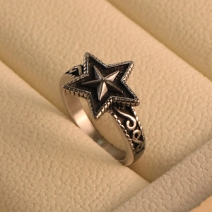 Vintage titanium steel star ring with gothic scroll engravings and polished finish