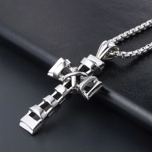 Titanium steel cross necklace with geometric cutout design on dark leather background