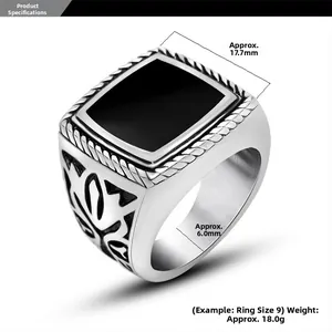Macro view of vintage stainless steel ring with 17.7mm black resin top and side carvings