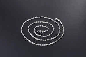 Detailed view of silver stainless steel rope chain with a secure lobster clasp