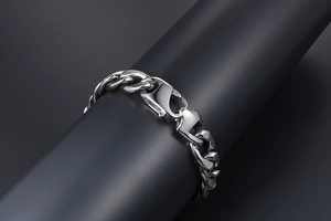 Macro view of polished stainless steel cuban chain with large lobster clasp on display