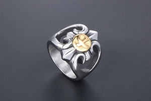 Macro detail of punk eagle ring showing gold eagle emblem and hollow cross design