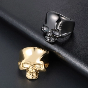 Gothic skull rings for men in gold and gunmetal finish with polished metallic texture