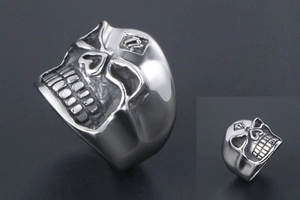 Detailed view of silver skull ring featuring heart-shaped eyes and number 13 engraving