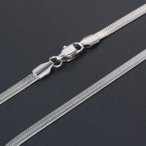 Flat silver herringbone chain necklace with lobster clasp in a minimalist sleek metal finish