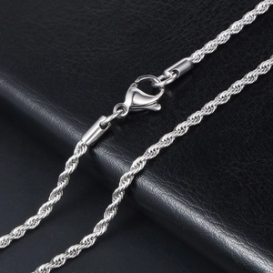 Silver titanium steel rope chain necklace with secure lobster clasp on leather background