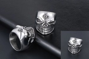 Detailed macro view of retro skull ring featuring embossed 1% logo on forehead