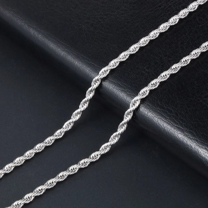 Polished stainless steel rope chain necklace for men on black leather background