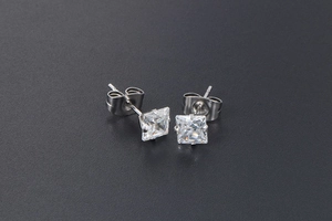 Detailed view of silver titanium steel square cubic zirconia stud earrings with butterfly back