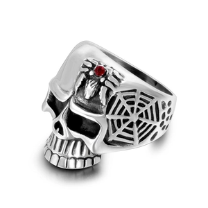 Vintage steel skull ring with red zircon spider on high-quality white background