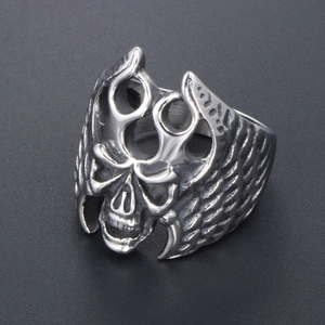Gothic punk skull ring in titanium steel with detailed side wings and oxidized finish