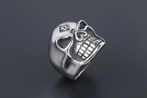 Detailed close-up of a vintage skull ring with 1 percent forehead engraving and metal relief