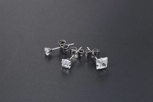 Close-up of square and round cubic zirconia stones set in titanium steel studs