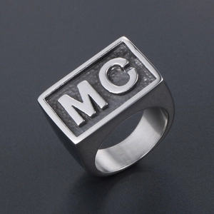 Minimalist silver stainless steel signet ring for men featuring black textured MC letters