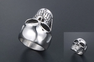 Detailed side and front view of a polished titanium steel punk skull ring with 3D details