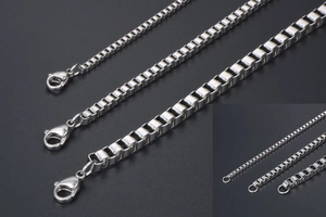 Detailed close-up of stainless steel box chains with lobster clasp and secure end rings