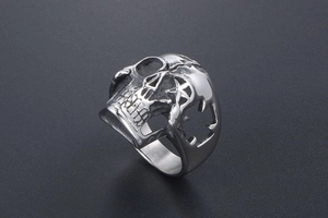 Macro detail of gothic skull ring in stainless steel with hollow star carvings