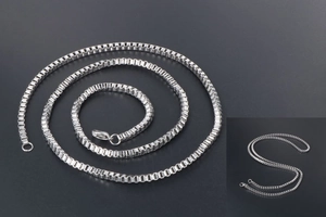 Detailed view of silver box chain necklace in stainless steel with lobster clasp closure