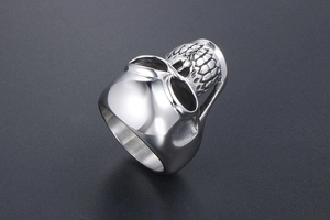 Detailed view of punk skull ring with polished finish and gothic vintage steel texture