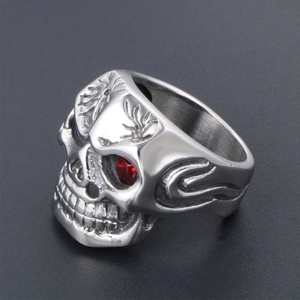 Gothic skull ring in vintage stainless steel featuring a striking red gemstone eye inlay