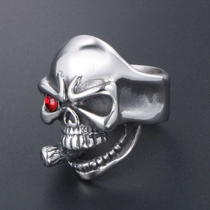 Punk style stainless steel skull ring with red rhinestone eye and cigar detail