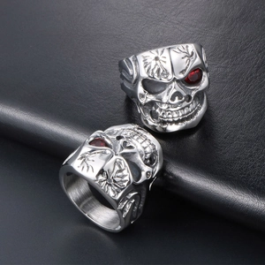 Punk style silver stainless steel skull ring with red eye gemstone detail