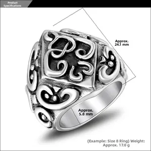 Detailed view of vintage silver ring with floral patterns showing 24.1mm face width