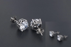 Close-up of vintage titanium steel stud earrings with brilliant-cut round cubic zirconia
